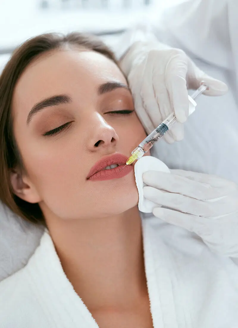 Woman getting a lip injection