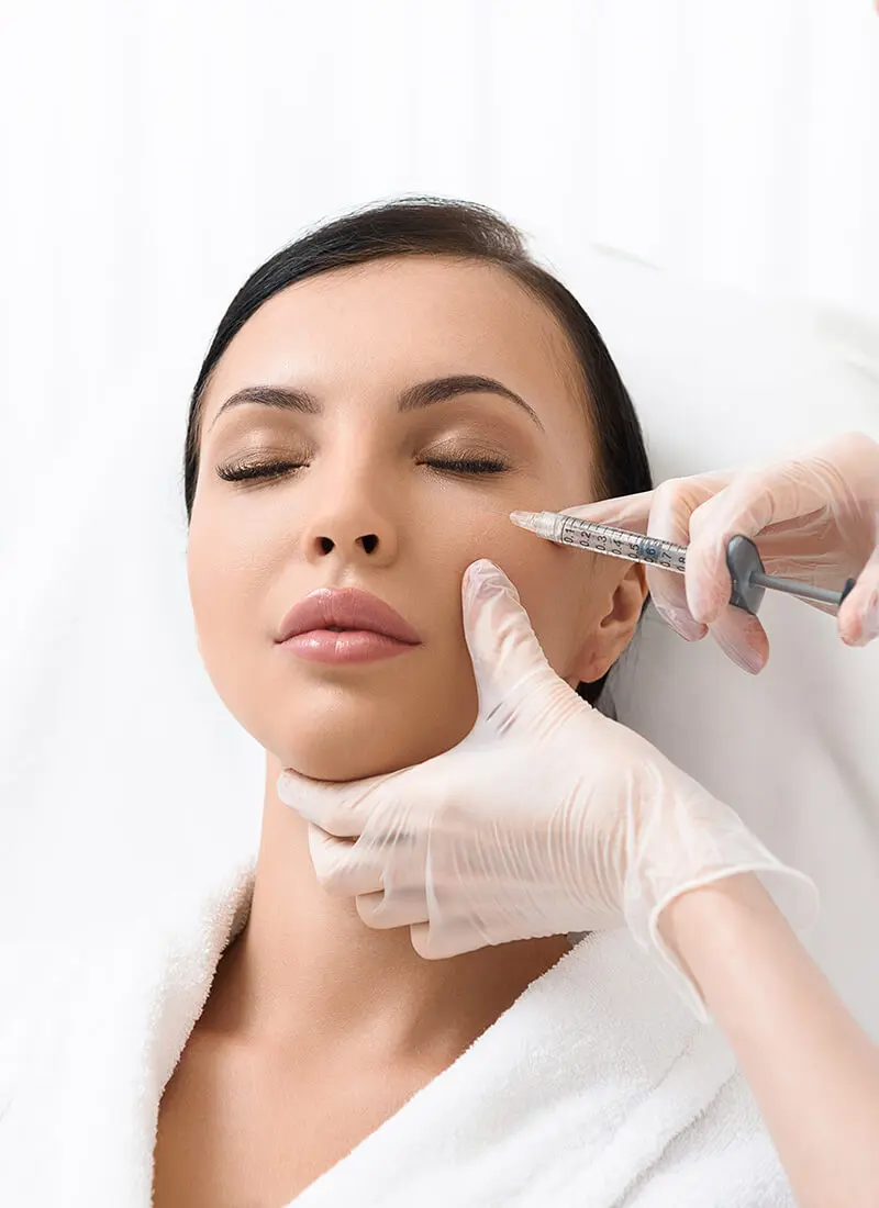 Woman getting a facial injection