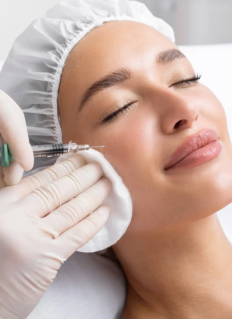Woman getting a facial injection