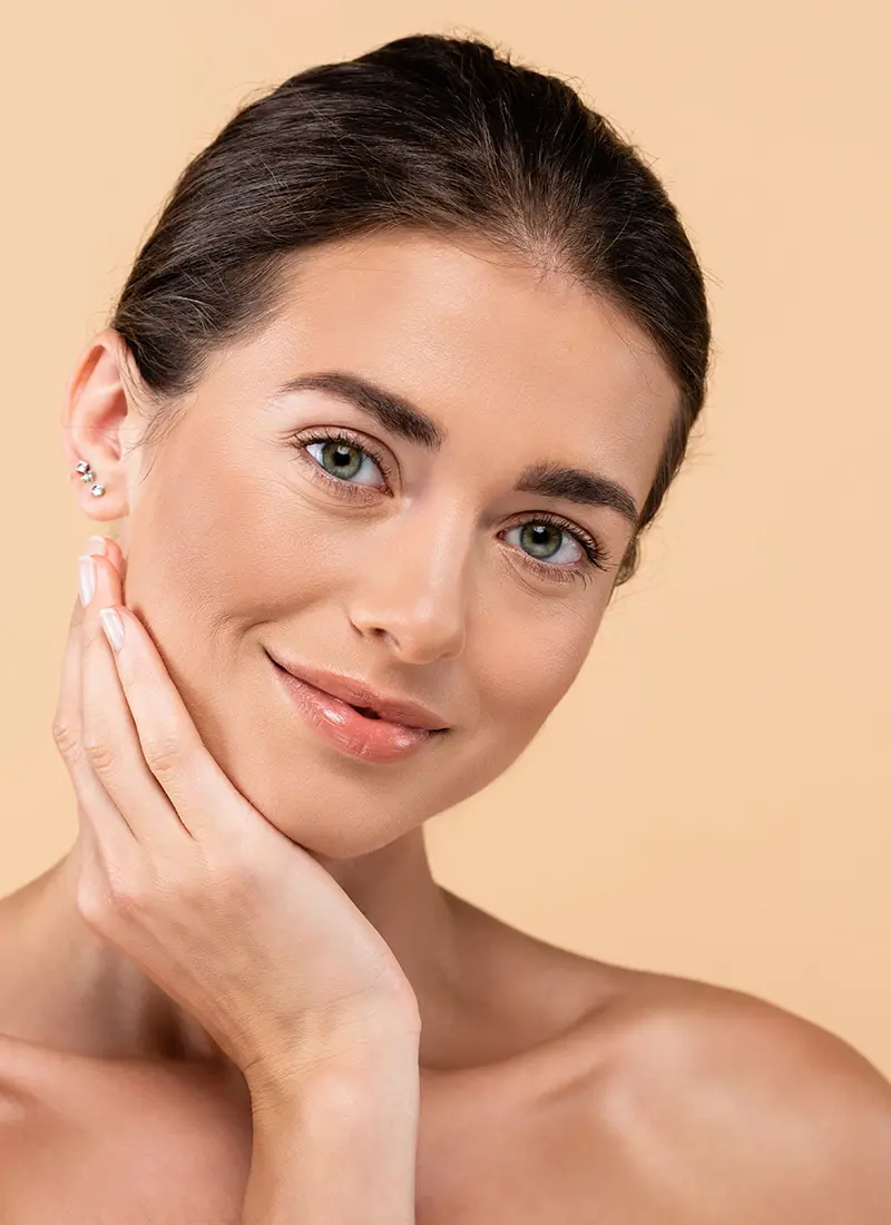 Young woman with her hand on her chin